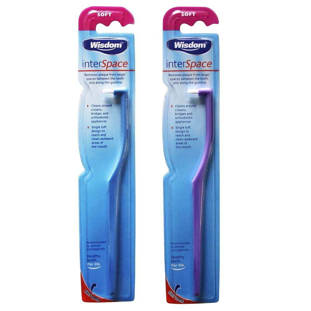 Two Wisdom Interspace Brush dental interdental cleaners in blue and purple packaging designed for plaque removal between teeth and around gums