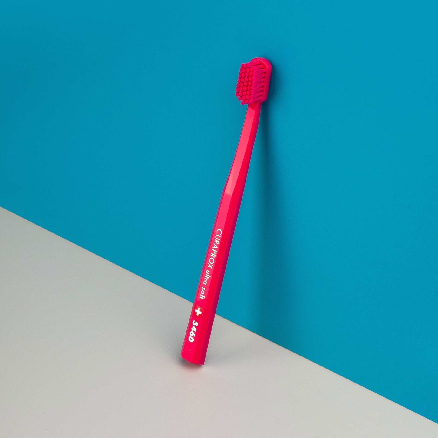 Curaprox CS 5460 ultra soft toothbrush with densely packed bristles for gentle and effective teeth cleaning in bright pink color