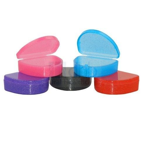 Brightly colored compact retainer and aligner storage boxes with hinged lids and air holes for hygiene