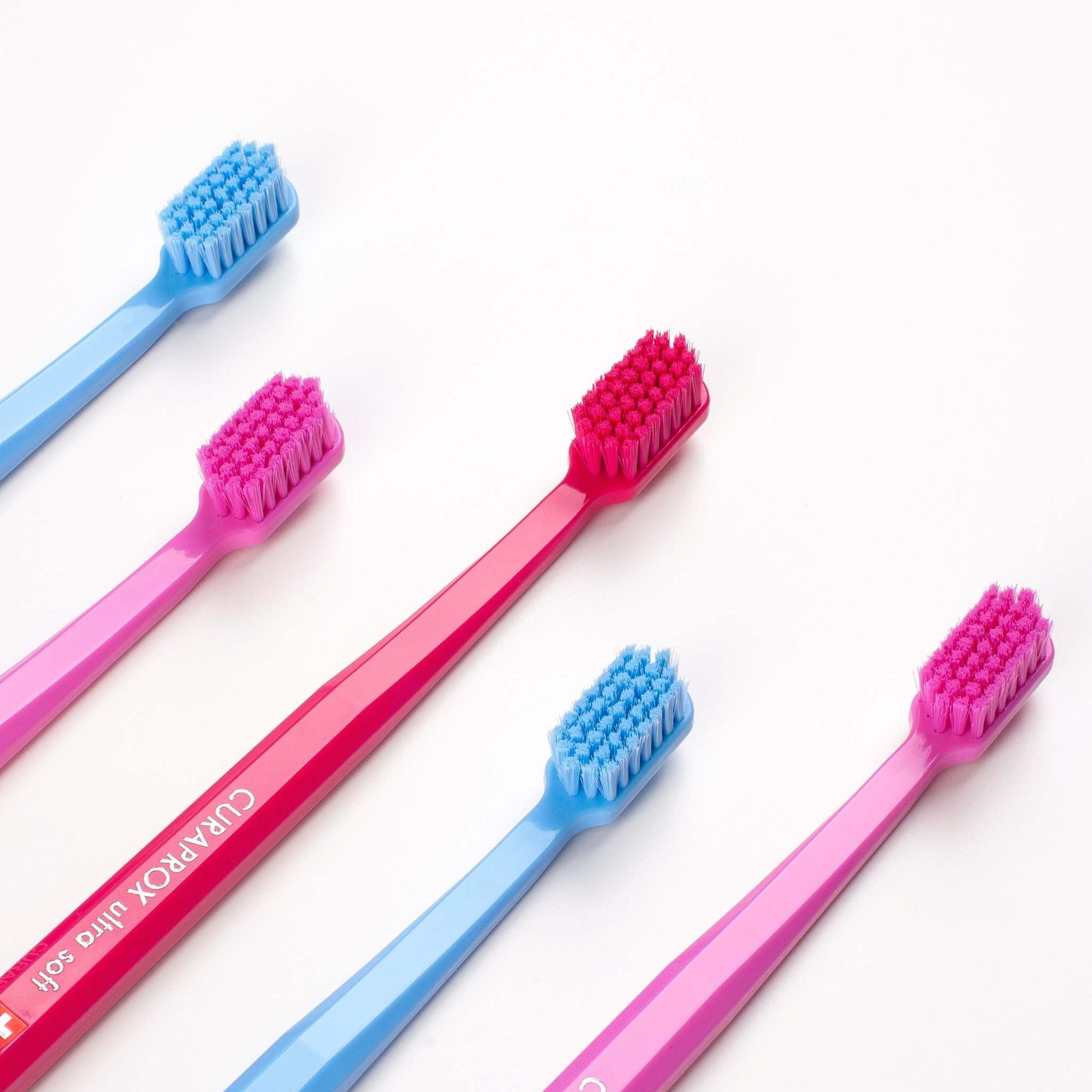 Curaprox CS 5460 ultra soft toothbrushes in assorted colors with densely packed fine bristles for gentle and effective cleaning