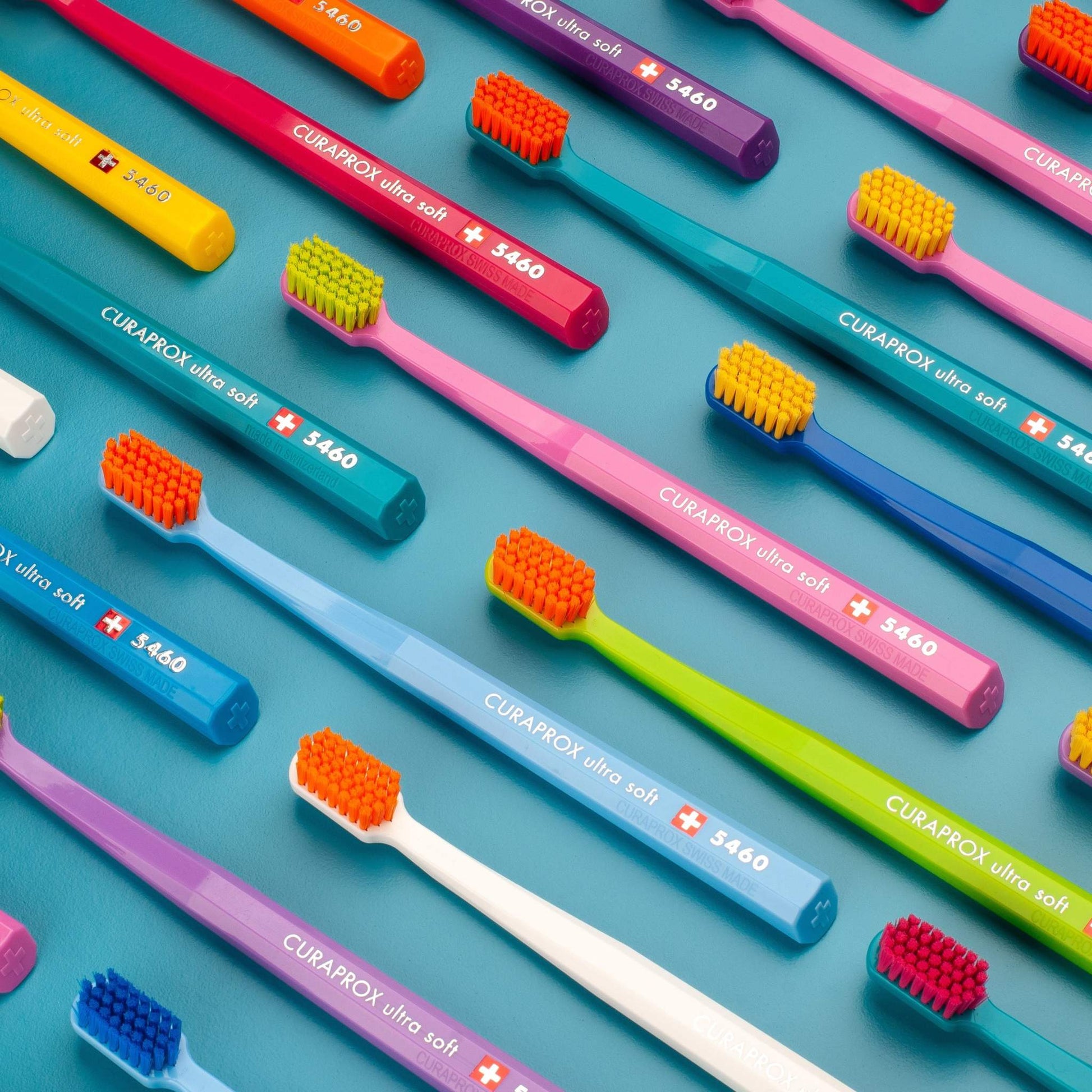 Curaprox CS 5460 ultra soft toothbrushes in assorted colors with dense, gentle bristles for effective plaque removal and gum care.