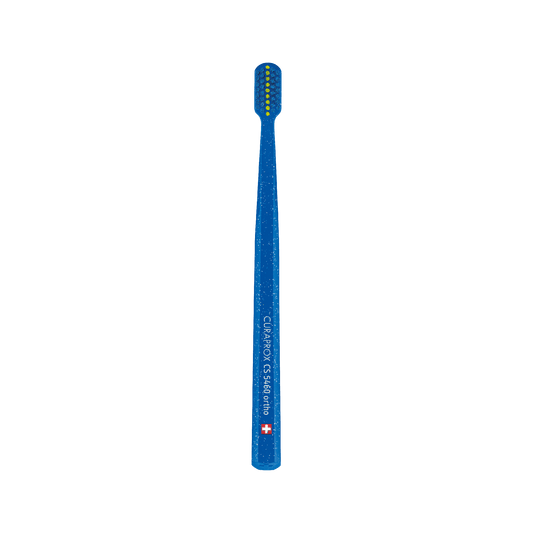 Curaprox CS 5460 orthodontic toothbrush with ultra-soft bristles and V-trim shape for braces care.